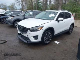 2016 Mazda CX-5 Grand Touring with VIN JM3KE4DY3G0838204, listed as a IAAI auction lot 41961049 with 98,918 mi miles and . Bid and sale history available at carsss.com. Image 2.