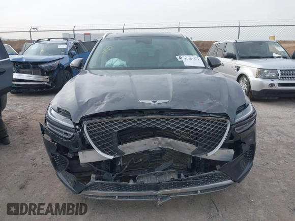 2022 Genesis GV70 2.5T with VIN KMUMADTB2NU065058, listed as a IAAI auction lot 41707351 with 77,831 mi miles and . Bid and sale history available at DreamBid. Image 12.