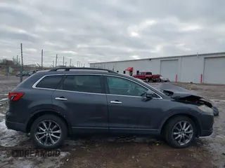 2015 Mazda CX-9 Grand Touring with VIN JM3TB2DAXF0447537, listed as a IAAI auction lot 41191694 with 157,113 mi miles. Bid and sale history available at carsss.com. Image 13.