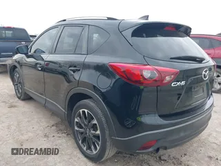 2016 Mazda CX-5 Grand Touring with VIN JM3KE2DY0G0651300, listed as a IAAI auction lot 41678833 with 98,790 mi miles. Bid and sale history available at carsss.com. Image 3.
