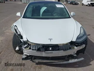 2018 Tesla Model 3 Long Range Battery with VIN 5YJ3E1EA3JF057527, listed as a IAAI auction lot 42072126 with 1 mi miles. Bid and sale history available at carsss.com. Image 10.