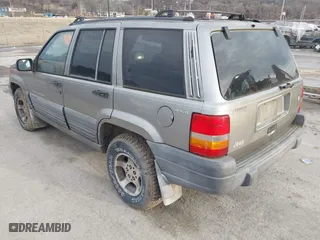 1997 Jeep Grand Cherokee Laredo with VIN 1J4GZ58S4VC745129, listed as a IAAI auction lot 41641005 with 1 mi miles. Bid and sale history available at carsss.com. Image 3.