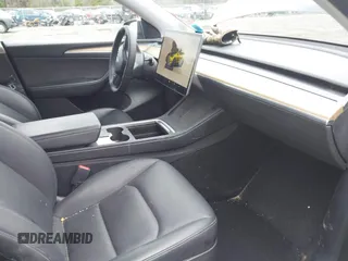 2022 Tesla Model Y Long Range with VIN 7SAYGDEE5NA016892, listed as a IAAI auction lot 41936735 with 69,136 mi miles and . Bid and sale history available at carsss.com. Image 5.