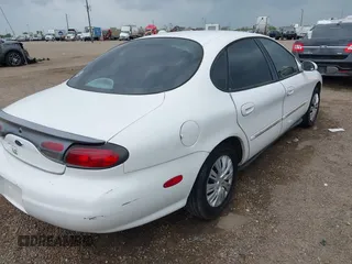 1998 Ford Taurus LX z VIN 1FAFP52U7WA146892, wystawiony jako IAAI lot #42313955 z przebiegiem 133 743 mil mil oraz . Historia ofert i sprzedaży dostępna na DreamBid. Obrazek 6.