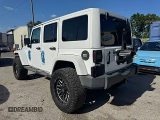 2012 Jeep Wrangler Unlimited Altitude z VIN 1C4HJWEG5CL222948, wystawiony jako Copart lot #61101825 z przebiegiem 106 991 mil mil oraz Czysty tytuł • Clean title. Historia ofert i sprzedaży dostępna na DreamBid. Obrazek 3.