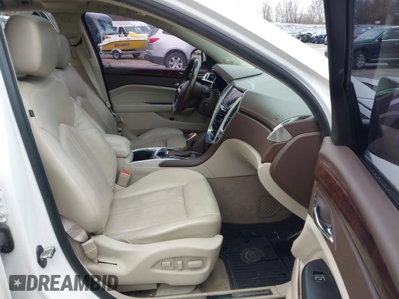 2014 Cadillac SRX Premium Collection z VIN 3GYFNDE34ES548826, wystawiony jako IAAI lot #40792942 z przebiegiem 115 984 mil mil oraz . Historia ofert i sprzedaży dostępna na DreamBid. Obrazek 5.