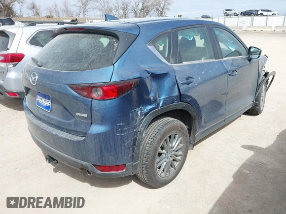 2018 Mazda CX-5 Sport with VIN JM3KFBBM8J0400741, listed as a IAAI auction lot 41860323 with 54,911 mi miles. Bid and sale history available at carsss.com. Image 4.