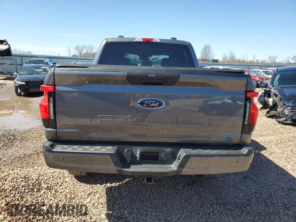 2023 Ford F-150 Lightning Pro z VIN 1FTVW1EL8PWG10894, wystawiony jako Copart lot #50988655 z przebiegiem 34 020 mil mil oraz Szkody całkowita. Historia ofert i sprzedaży dostępna na DreamBid. Obrazek 6.