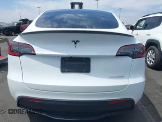2022 Tesla Model Y Performance with VIN 7SAYGDEF8NF407109, listed as a IAAI auction lot 42014282 with 24,937 mi miles and . Bid and sale history available at DreamBid. Image 16.