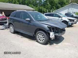 2016 Mazda CX-5 Touring z VIN JM3KE4CY3G0757608, wystawiony jako IAAI lot #42400467 z przebiegiem 149 157 mil mil oraz . Historia ofert i sprzedaży dostępna na DreamBid. Obrazek 1.