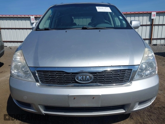 2012 Kia Sedona LX with VIN KNDMG4C70C6491703, listed as a IAAI auction lot 42128411 with 246,586 mi miles. Bid and sale history available at carsss.com. Image 6.