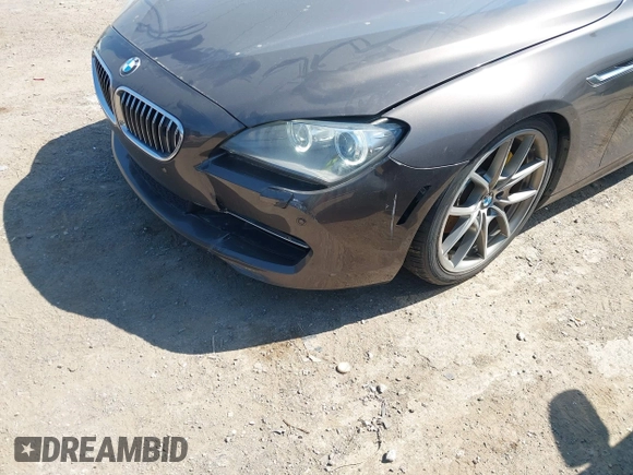 2012 BMW 6 Series 650i z VIN WBALX3C57CC528832, wystawiony jako IAAI lot #41779268 z przebiegiem 75 119 mil mil oraz . Historia ofert i sprzedaży dostępna na DreamBid. Obrazek 17.