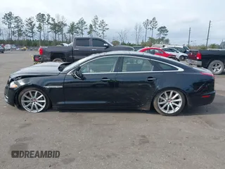 2015 Jaguar XJ with VIN SAJWA1CZ9F8V78228, listed as a IAAI auction lot 41260138 with 52,622 mi miles. Bid and sale history available at carsss.com. Image 14.