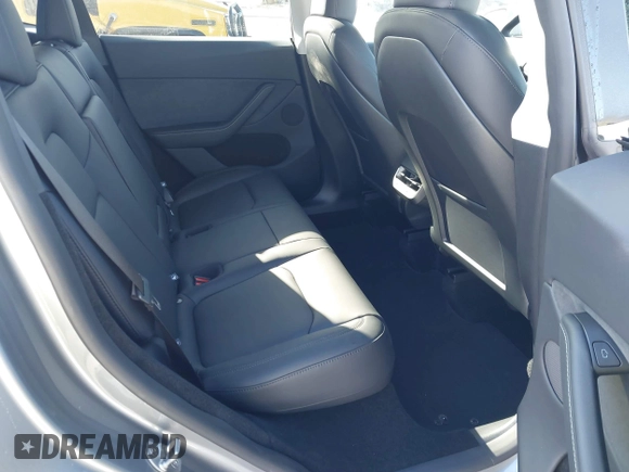 2025 Tesla Model Y Long Range with VIN 7SAYGDED7SA376233, listed as a IAAI auction lot 41777876 with 70 mi miles and . Bid and sale history available at DreamBid. Image 8.
