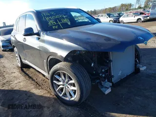 2023 BMW X5 xDrive40i with VIN 5UXCR6C01P9P96005, listed as a IAAI auction lot 41415624 with 15,879 mi miles. Bid and sale history available at carsss.com. Image 1.