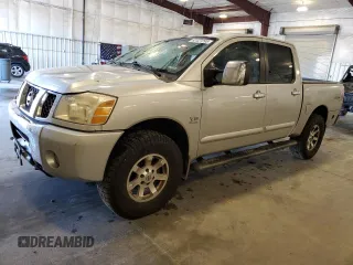 2004 Nissan Titan LE with VIN 1N6AA07B74N553713, listed as a Copart auction lot 62427295 with 208,300 mi miles and Salvage title. Bid and sale history available at DreamBid. Image 1.