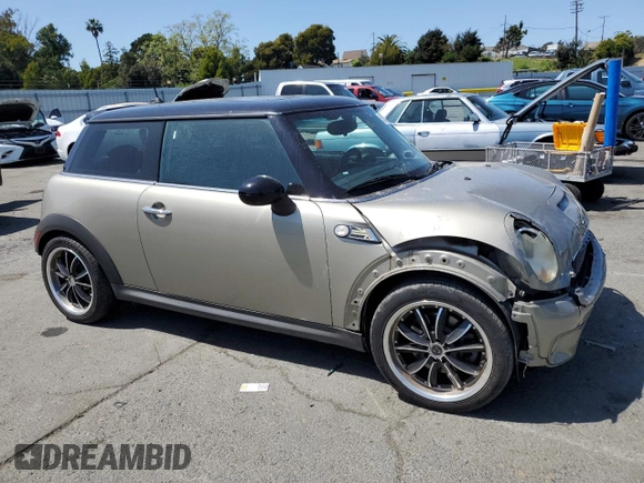 2009 MINI Hardtop S with VIN WMWMF73549TT94143, listed as a Copart auction lot 52120615 with 144,334 mi miles and Salvage Title. Bid and sale history available at DreamBid. Image 4.