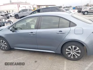 2022 Toyota Corolla Hybrid LE with VIN JTDEAMDE4NJ041913, listed as a IAAI auction lot 41883490 with 23,063 mi miles. Bid and sale history available at carsss.com. Image 14.
