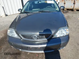 2004 Mercury Sable LS Premium z VIN 1MEHM55S54G607845, wystawiony jako IAAI lot #41812758 z przebiegiem 200 883 mil mil oraz . Historia ofert i sprzedaży dostępna na DreamBid. Obrazek 6.