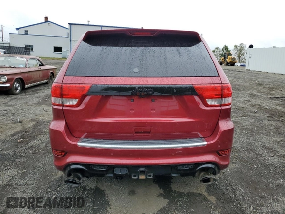 2012 Jeep Grand Cherokee SRT8 with VIN 1C4RJFDJ0CC351195, listed as a Copart auction lot 72794454 with 104,672 mi miles and Salvage Title. Bid and sale history available at carsss.com. Image 6.