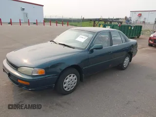 1996 Toyota Camry DX z VIN JT2BG12K0T0417267, wystawiony jako IAAI lot #42386332 z przebiegiem 222 688 mil mil oraz . Historia ofert i sprzedaży dostępna na DreamBid. Obrazek 2.