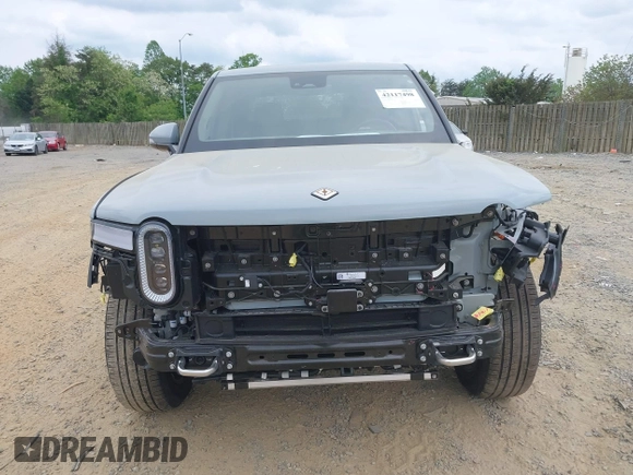2023 Rivian R1T Adventure z VIN 7FCTGBAA6PN028520, wystawiony jako IAAI lot #42117498 z przebiegiem 24 583 mil mil oraz . Historia ofert i sprzedaży dostępna na DreamBid. Obrazek 13.