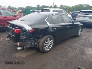 2014 Infiniti Q50 Premium z VIN JN1BV7AR4EM695232, wystawiony jako IAAI lot #42367581 z przebiegiem 138 063 mil mil oraz . Historia ofert i sprzedaży dostępna na DreamBid. Obrazek 4.