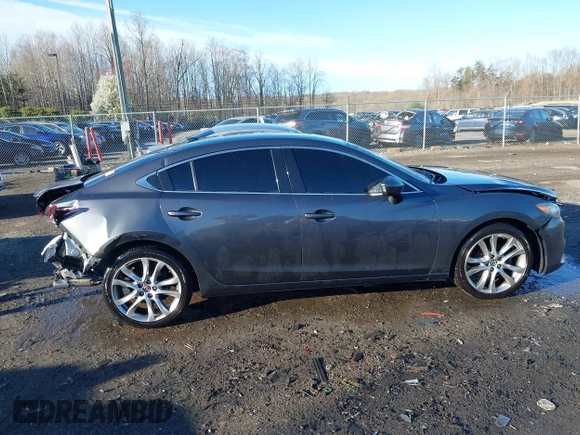 2014 Mazda 6 i Grand Touring with VIN JM1GJ1W50E1107877, listed as a IAAI auction lot 41857596 with 166,188 mi miles and . Bid and sale history available at DreamBid. Image 14.
