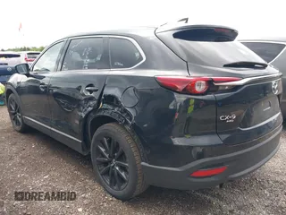 2023 Mazda CX-9 Touring Plus with VIN JM3TCBAY2P0657825, listed as a IAAI auction lot 42756562 with 52,090 mi miles and . Bid and sale history available at DreamBid. Image 3.