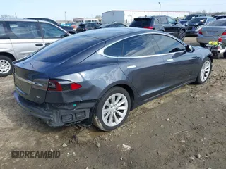 2017 Tesla Model S 100D with VIN 5YJSA1E23HF198592, listed as a IAAI auction lot 41721755 with 127,946 mi miles. Bid and sale history available at carsss.com. Image 4.