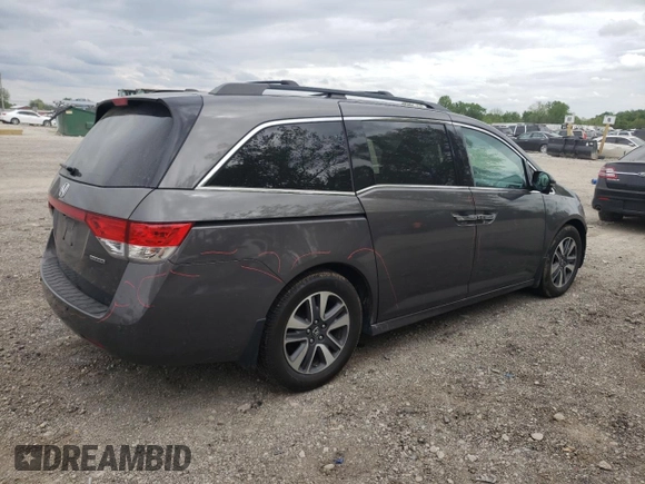 2014 Honda Odyssey Touring with VIN 5FNRL5H90EB014360, listed as a Copart auction lot 56699845 with 180,913 mi miles and Salvage title. Bid and sale history available at DreamBid. Image 3.