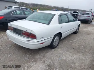 1999 Buick Park Avenue Ultra with VIN 1G4CU5217X4658627, listed as a IAAI auction lot 42013174 with 148,856 mi miles. Bid and sale history available at carsss.com. Image 4.