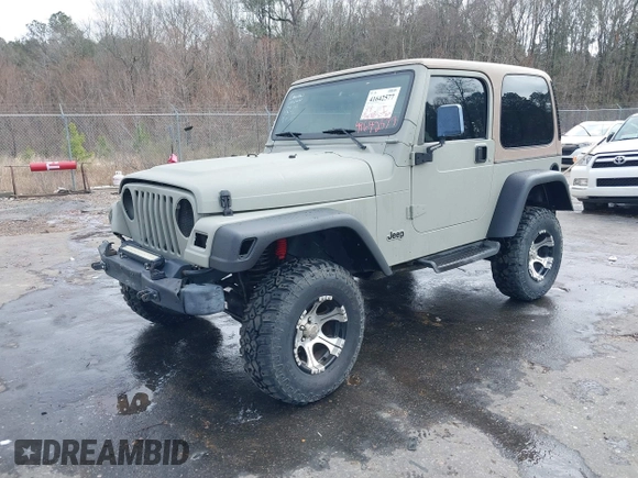 1999 Jeep Wrangler Sahara with VIN 1J4FY49S0XP480017, listed as a IAAI auction lot 41642577 with 154,068 mi miles. Bid and sale history available at carsss.com. Image 2.