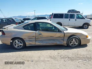 2001 Pontiac Grand Am z VIN 1G2NF12T51M534918, wystawiony jako IAAI lot #42055289 z przebiegiem 128 155 mil mil oraz . Historia ofert i sprzedaży dostępna na DreamBid. Obrazek 14.