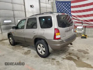 2001 Mazda Tribute LX with VIN 4F2CU08101KM05943, listed as a Copart auction lot 84077694 with 137,937 mi miles and Salvage Title. Bid and sale history available at DreamBid. Image 2.