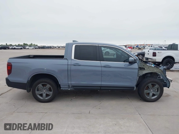 2023 Honda Ridgeline RTL with VIN 5FPYK3F58PB047099, listed as a IAAI auction lot 42313390 with Not provided miles and . Bid and sale history available at DreamBid. Image 14.