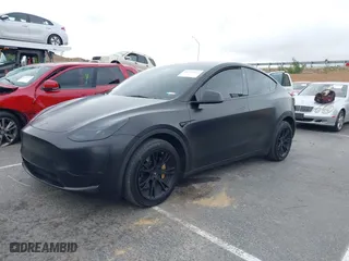 2023 Tesla Model Y Long Range with VIN 7SAYGDEE2PF811100, listed as a IAAI auction lot 41571267 with 56,369 mi miles. Bid and sale history available at carsss.com. Image 20.