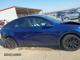 2021 Tesla Model Y Standard Range with VIN 5YJYGDED5MF121874, listed as a IAAI auction lot 41238170 with 72,041 mi miles and . Bid and sale history available at DreamBid. Image 13.