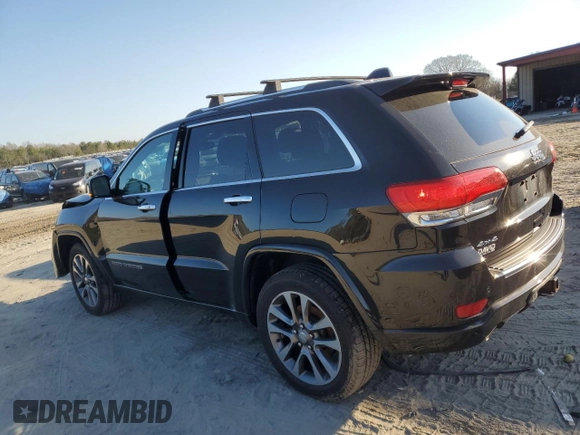 2017 Jeep Grand Cherokee Overland with VIN 1C4RJFCT5HC828780, listed as a Copart auction lot 46874965 with 90,269 mi miles and Salvage Title. Bid and sale history available at carsss.com. Image 2.