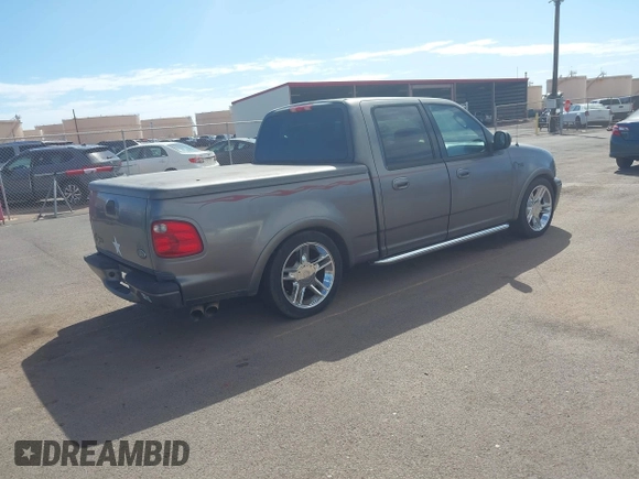 2002 Ford F-150 Harley Davidson with VIN 1FTRW07312KC88379, listed as a IAAI auction lot 41657219 with 1 mi miles. Bid and sale history available at carsss.com. Image 4.