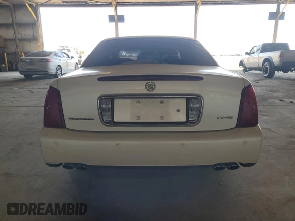 2001 Cadillac DeVille DHS z VIN 1G6KE57Y41U150631, wystawiony jako Copart lot #61805295 z przebiegiem 96 158 mil mil oraz Czysty tytuł • Clean title. Historia ofert i sprzedaży dostępna na DreamBid. Obrazek 6.