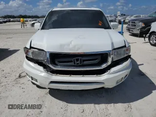 2010 Honda Ridgeline RTL with VIN 5FPYK1F51AB011041, listed as a Copart auction lot 77210844 with 81,265 mi miles and Salvage Title. Bid and sale history available at carsss.com. Image 5.