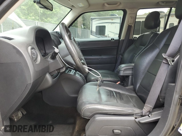 2016 Jeep Patriot High Altitude with VIN 1C4NJRFBXGD595443, listed as a Copart auction lot 59985755 with 171,776 mi miles and Salvage title. Bid and sale history available at DreamBid. Image 7.