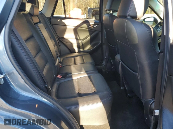 2015 Mazda CX-5 Grand Touring with VIN JM3KE2DY9F0483509, listed as a Copart auction lot 87406944 with 176,213 mi miles and Salvage Title. Bid and sale history available at carsss.com. Image 11.