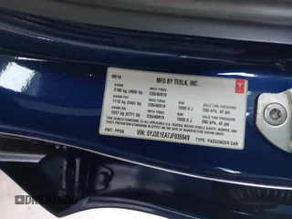 2018 Tesla Model 3 Long Range Battery z VIN 5YJ3E1EA7JF035949, wystawiony jako IAAI lot #41627027 z przebiegiem Nie podano mil oraz . Historia ofert i sprzedaży dostępna na DreamBid. Obrazek 9.