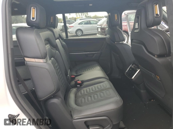 2025 Rivian R1S Adventure z VIN 7PDSGBBA1SN051768, wystawiony jako Copart lot #43838115 z przebiegiem 4875 mil mil oraz Szkoda całkowita • Salvage title. Historia ofert i sprzedaży dostępna na DreamBid. Obrazek 12.