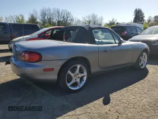 2003 Mazda MX-5 Miata Cloth with VIN JM1NB353430308653, listed as a Copart auction lot 53129865 with 144,549 mi miles and Salvage Title. Bid and sale history available at DreamBid. Image 3.