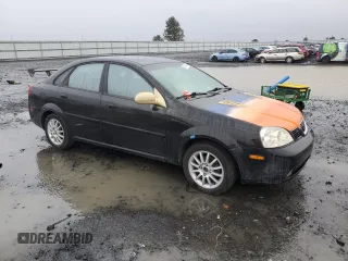2004 Suzuki Forenza z VIN KL5JJ52Z44K953823, wystawiony jako Copart lot #86589504 z przebiegiem 150 699 mil mil oraz Tytuł czysty. Historia ofert i sprzedaży dostępna na DreamBid. Obrazek 4.