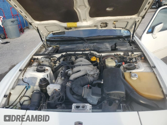 1987 Porsche 944 z VIN WP0AB0948HN473051, wystawiony jako Copart lot #73666654 z przebiegiem 82 580 mil mil oraz Szkoda całkowita • Salvage title. Historia ofert i sprzedaży dostępna na DreamBid. Obrazek 11.