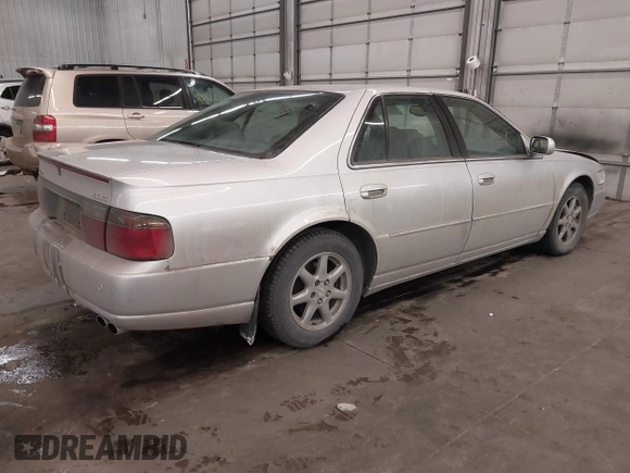 2003 Cadillac Seville Luxury SLS z VIN 1G6KS54Y93U200813, wystawiony jako IAAI lot #41544661 z przebiegiem 159 550 mil mil oraz . Historia ofert i sprzedaży dostępna na DreamBid. Obrazek 4.